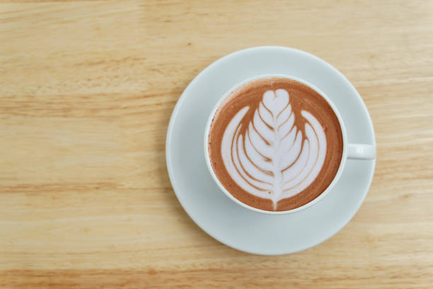 istock Cup of hot coffee on wood floor. 1323146607