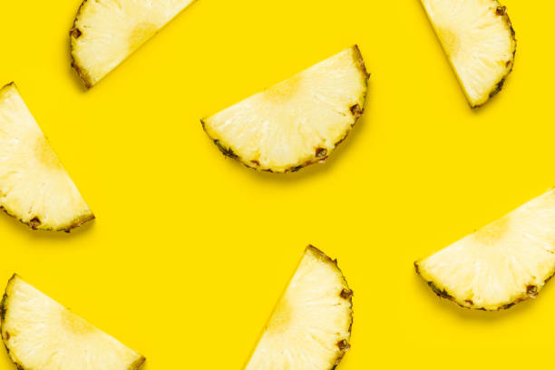 istock Pineapple slice against on a yellow background. Top view, flat lay 1323153154