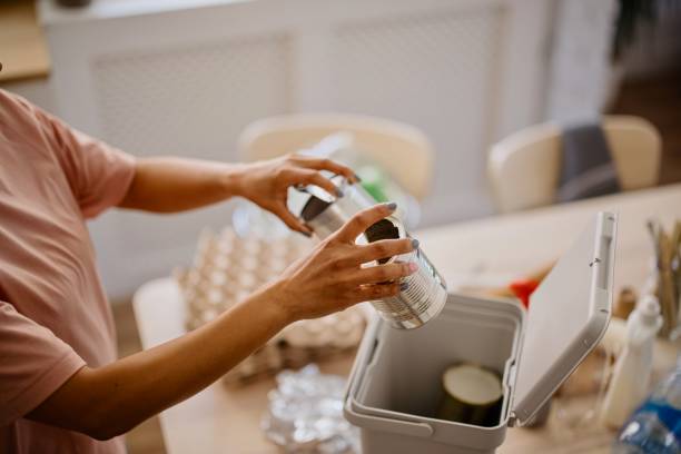 istock Woman sorting the metal waste 1323154263