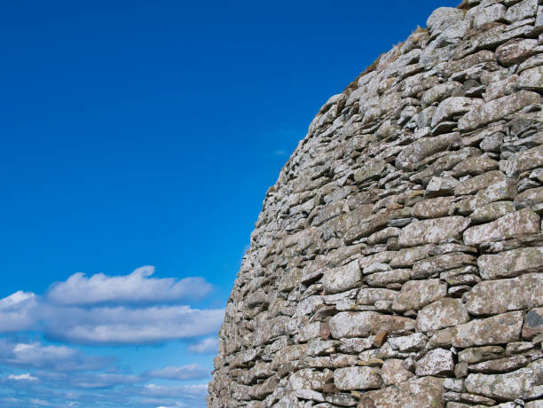 The dry stone wall structure of the Broch of Clickimin in Lerwick, Shetland, UK - taken on a sunny day with blue sky and white clouds The dry stone wall structure of the Broch of Clickimin in Lerwick, Shetland, UK - taken on a sunny day with blue sky and white clouds broch of clickimin stock pictures, royalty-free photos & images