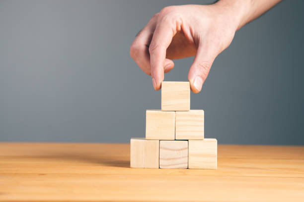 istock Hand holding wooden block cubes 1323157479