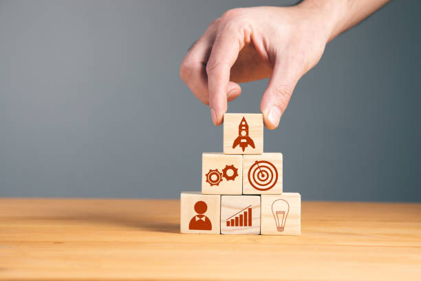 istock Man holding wooden blocks with rocket 1323157521