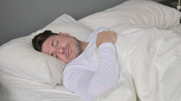 istock Insomniac Middle Aged Man Unable to Sleep in Bed 1323159382