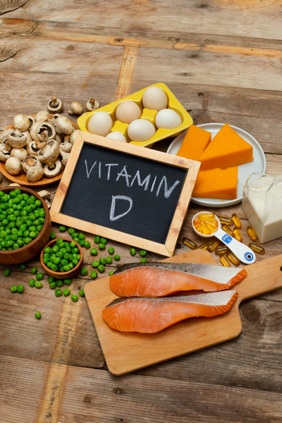 Foods rich in vitamin D Foods rich in vitamin D on a wooden table vitamin rich stock pictures, royalty-free photos & images