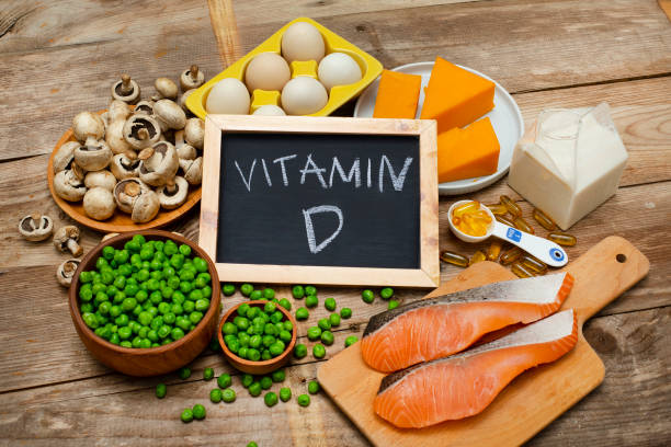 Foods rich in vitamin D Foods rich in vitamin D on a wooden table vitamin stock pictures, royalty-free photos & images