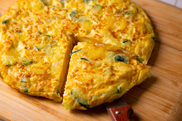 istock Traditional Spanish omelette with zucchini and potatoes. 1323163140