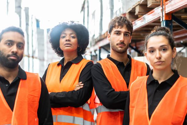 istock Portrait of a warehouse team 1323164595