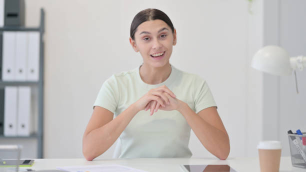 istock Online Video Chat by Young Latin Woman 1323164749