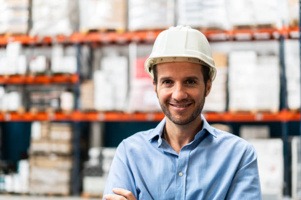 istock Portrait of smiling mature warehouse supervisor 1323164758