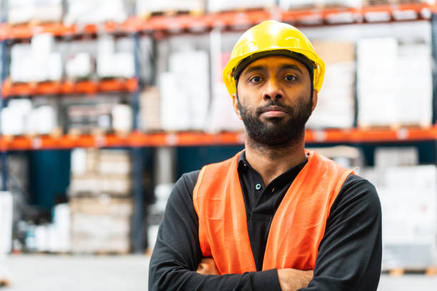 istock Portrait of confident warehouse worker 1323164847