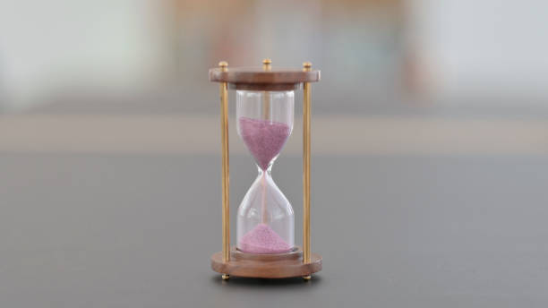istock Close up of Hourglass on Table, Sand Clock 1323164911