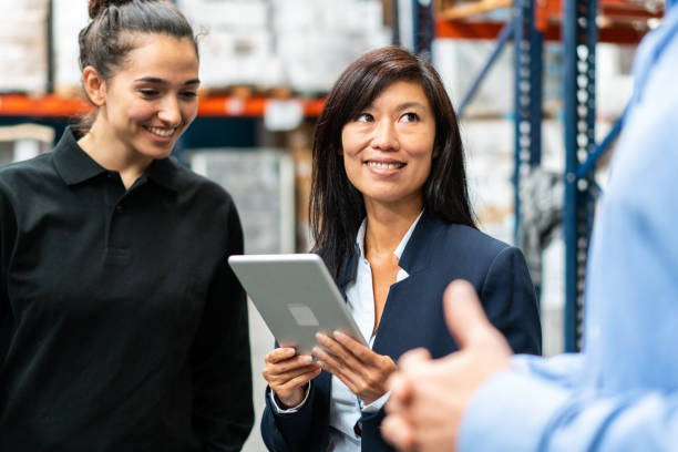 istock Warehouse manager discussing and planning with team 1323164967