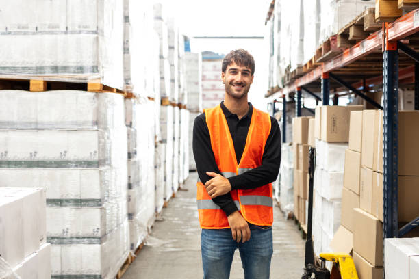 istock Portrait of a young man working in a distribution warehouse 1323165058