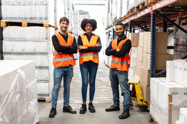 istock Group portrait of distribution warehouse staff 1323165194