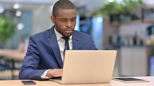 istock African Businessman Working on Laptop in Office 1323166041