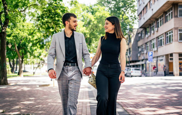 istock Beautiful young couple walking together 1323167251