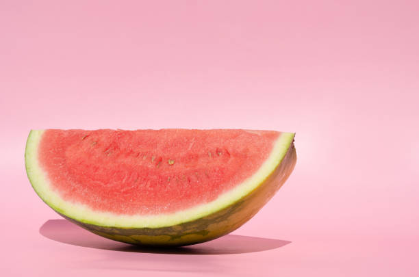 istock Watermelon slice on soft pink background. Summer color. Minimalist concept. 1323167863