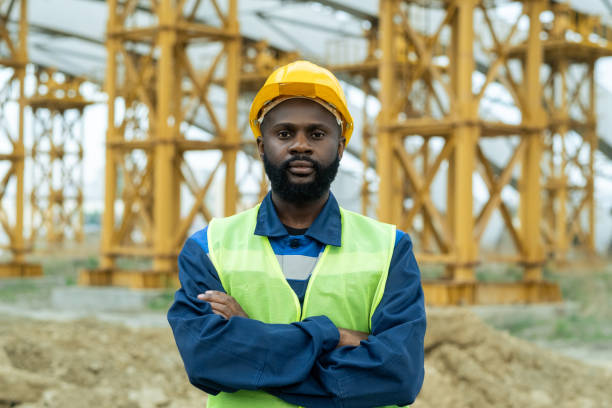 istock Young African construction worker in uniform and hardhat 1323169036