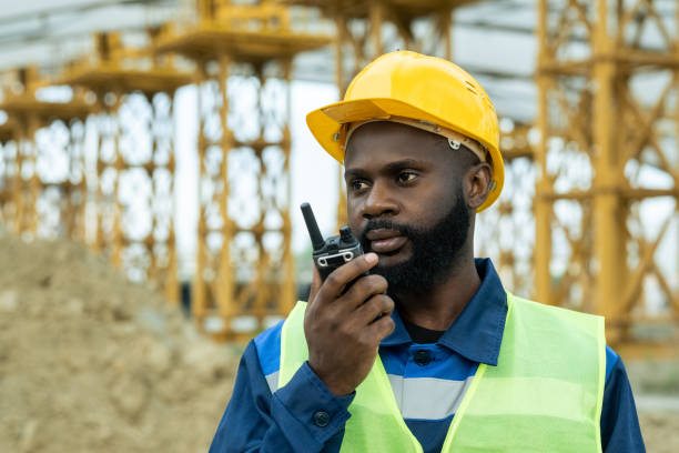 istock Male engineer of African ethnicity using walkie-talkie 1323169044