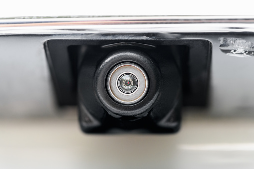 Car rear view camera, close up. Transportation background
