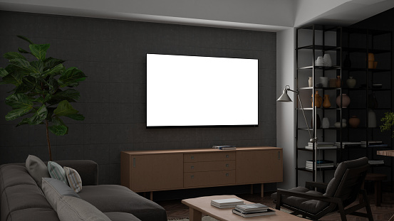 Glowing TV screen mock up at night in the living room with concrete wall. 3d illustration