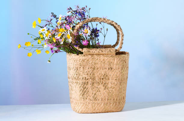 istock Straw bag with flowers 1323178715