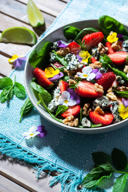 istock Fresh Sumer Salad with Strawberry on Table. 1323179957