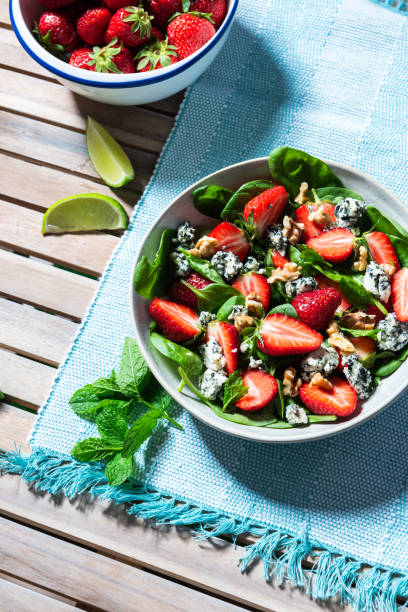 istock Fresh Sumer Salad with Strawberry on Table. 1323179990