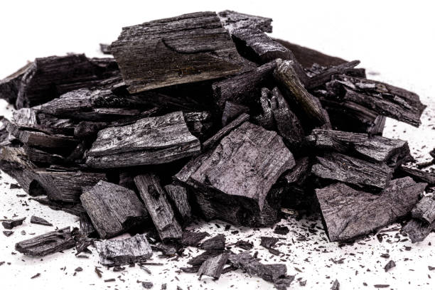 istock piece of wood-based charcoal, charcoal, with isolated white background 1323180655