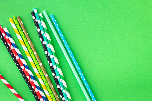 istock paper straws multicolored striped dotted straws scattered Flat lay useful ecology cocktail or juice, lemonade to usebiodegradable on the table concept party healthy meal copy space food background 1323182113