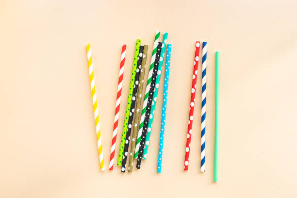 istock paper straws multicolored striped dotted straws scattered Flat lay useful ecology cocktail or juice, lemonade to usebiodegradable on the table concept party healthy meal copy space food background 1323182199