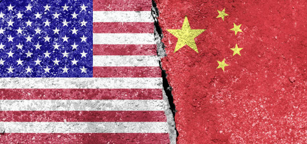 istock Two flags of USA and China 1323185617