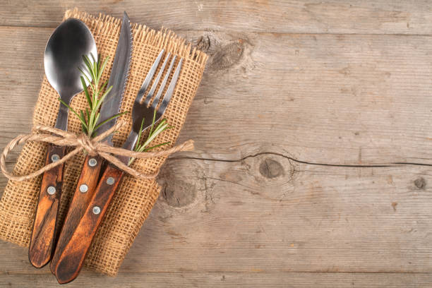 istock Spoon, fork, and knife along with linen napkin 1323186775