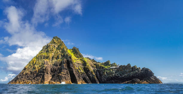 istock Panorama of entire beautiful Skellig Michael island with Skellig Lighthouse 1323188206