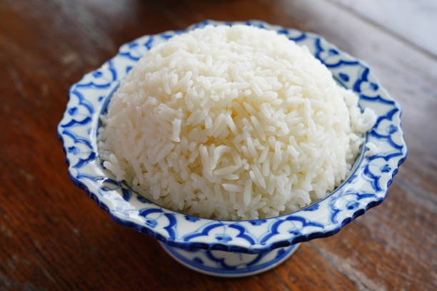 Cooked rice cooked rice in bowl on table Cup of Jasmine Rice stock pictures, royalty-free photos & images