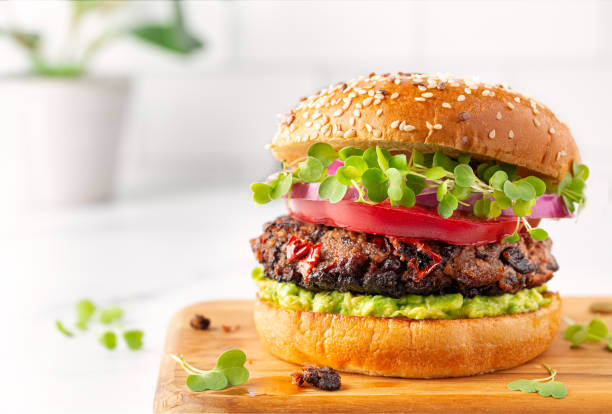 istock Plant based black bean burger on a sesame seed bun 1323194107