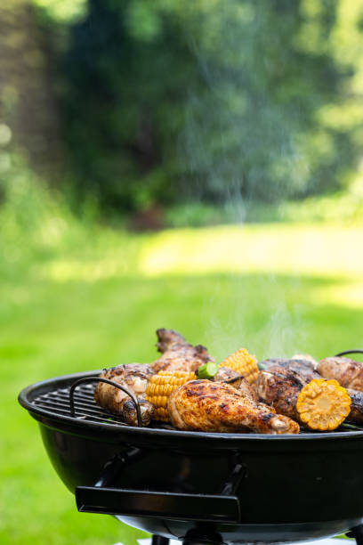 istock Charcoal BBQ Burning Fire in Garden Backyard 1323195231