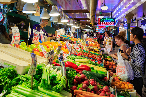 Seattle, WA, USA - July 23:  Vegetable Stand at Pike Place Market in downtown Seattle on July 23, 2018 in Seattle, Washington.