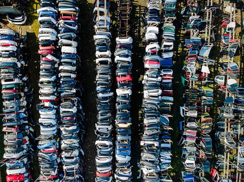 Row of Car Doors in Junkyard. Srap Metal Recycle. Abstract Pattern. Aerial Drone View.Cars in Demolition SIte. Junkyard and Scrap Metal Recucle . Aerial Drone View.