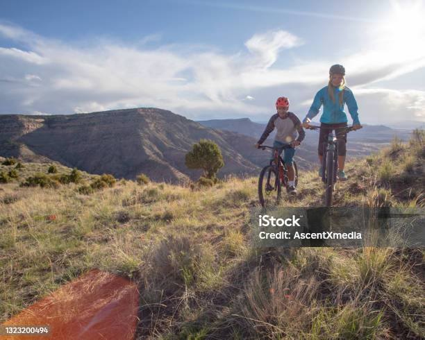 Mountain Bikers Follow Trail Along Mountain Ridge Stock Photo - Download Image Now - Colorado, Mountain Biking, Cycling