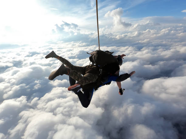 istock Tandem jump amazing sky 1323201098
