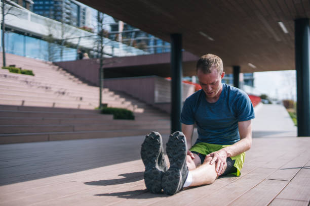 istock Young man stretches before heading out on morning run 1323205804