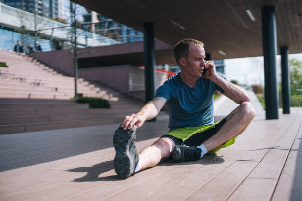 istock Young man stretches before heading out on morning run 1323206005