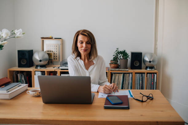 istock Successful Mature Businesswoman Working from Home, Using a Laptop 1323206637