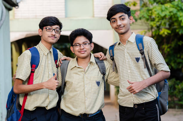 istock Portrait of a group of three young school students. 1323206936