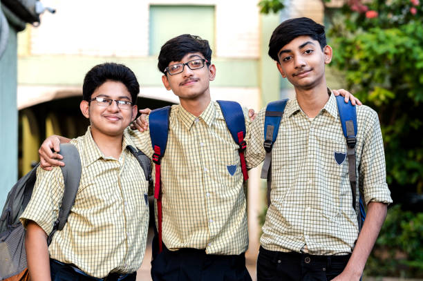 istock Portrait of a group of three young school students. 1323207793