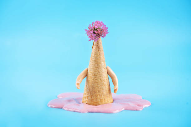 istock Inverted waffle cone with berry ice cream on a blue background 1323208323