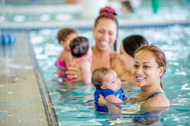 istock Mommy and me swimming class 1323208852