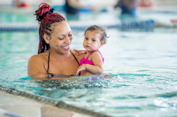 istock Mommy and me swimming class 1323208861