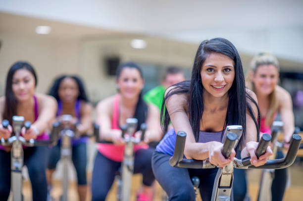 istock Group stationary bike  class 1323208936